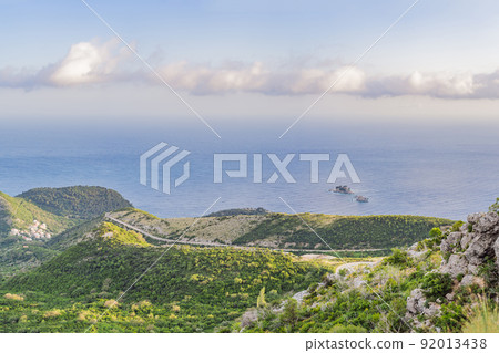 Aerial view of the small town Petrovac, Montenegro and Lucice beach Aerial view of the small town Petrovac, Montenegro and Lucice beach 92013438
