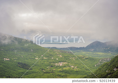 Beautiful view of the mountains of Montenegro and Skadar lake Beautiful view of the mountains of Montenegro and Skadar lake 92013439