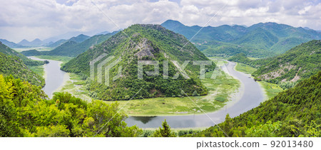 Canyon of Rijeka Crnojevica river near the Skadar lake coast. One of the most famous views of Montenegro. River makes a turn between the mountains and flows backward 92013480