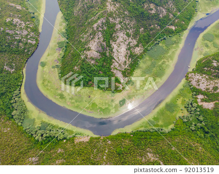 Canyon of Rijeka Crnojevica river near the Skadar lake coast. One of the most famous views of Montenegro. River makes a turn between the mountains and flows backward 92013519