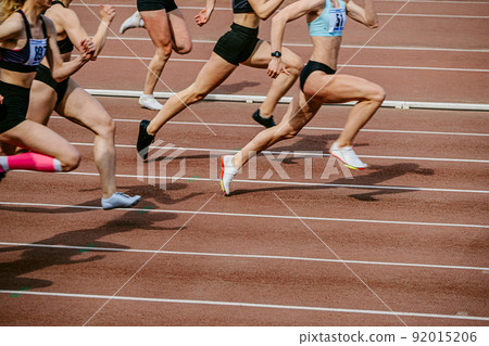group female athletes runners run sprint race 92015206