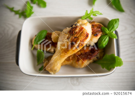 grilled chicken legs fried with spices and herbs 92015674
