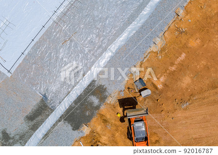 Before pouring concrete foundation for the building, barrier plastic must be installed to protect the foundation from water Before pouring concrete foundation for the building, barrier plastic must be installed to protect the foundation from water 92016787