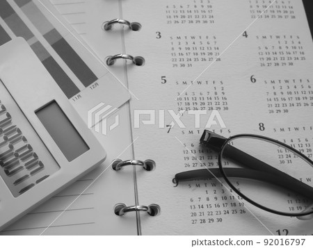 Business image of graphs, glasses, calendars, notebooks (female) 92016797