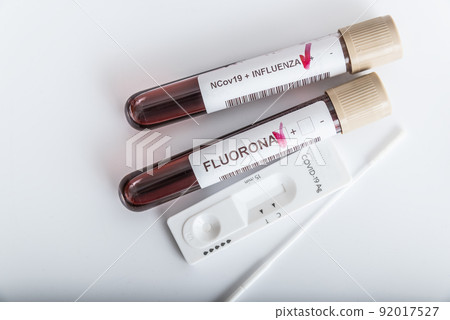 Blood samples of new variant OMICRON plus flu FLUORONA, covid19, coronavirus. Selective approach to the sample tube. 92017527