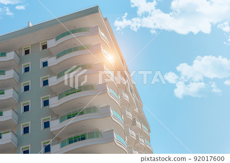 Corner of a residential block building against the sky. Corner of a residential block building against the sky. 92017600