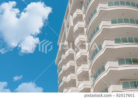 Corner of a residential block building against the sky. Corner of a residential block building against the sky. 92017601