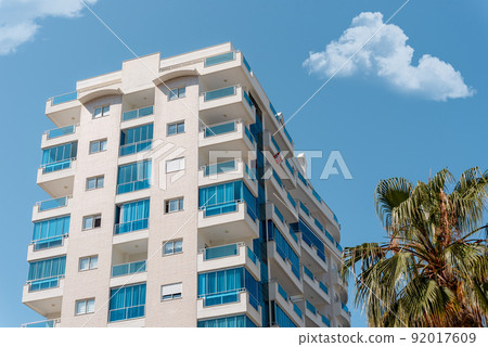 Modern building corner and windows. Multi-storey new multi-colored residential building. Modern building corner and windows. Multi-storey new multi-colored residential building. 92017609