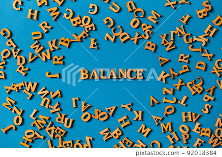 Word BALANCE made out of wooden letters on bright blue background. Motivational Words Quotes Concept. Word BALANCE made out of wooden letters on bright blue background. Motivational Words Quotes Concept. 92018384