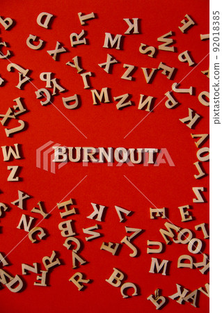 Word BURNOUT made out of wooden letters on bright red background. Motivational Words Quotes Concept. Word BURNOUT made out of wooden letters on bright red background. Motivational Words Quotes Concept. 92018385