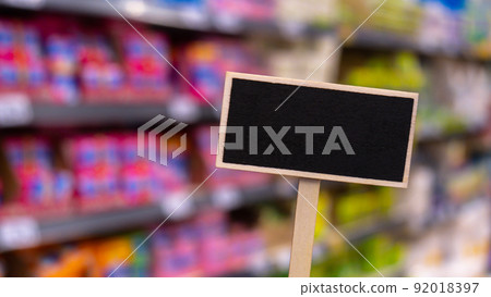 Blank Black billboard against shop Empty mockup template Blackboard label at shopping mall store. Shopping center. Department store. Shopping online Mindful spending 92018397