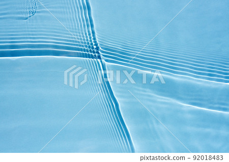 Beautiful oncoming waves, ripples on clear water, blue background Beautiful oncoming waves, ripples on clear water, blue background 92018483