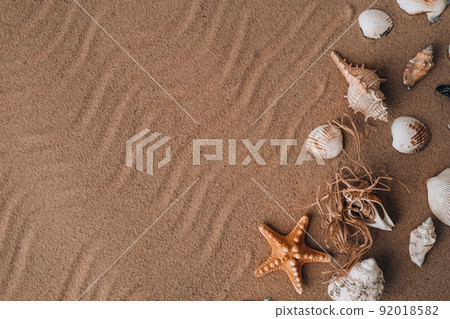 Composition frame for copy space, seashells, pebbles, mockup on sand background. Blank, top view, still life, flat lay. Sea summer vacation travel concept tourism and resorts. Composition frame for copy space, seashells, pebbles, mockup on sand background. Blank, top view, still life, flat lay. Sea summer vacation travel concept tourism and resorts. 92018582