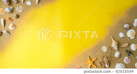 Composition frame for copy space, seashells, pebbles, mockup on yellow sand background. Blank, top view, still life, flat lay. sea vacation travel concept tourism and resorts. Composition frame for copy space, seashells, pebbles, mockup on yellow sand background. Blank, top view, still life, flat lay. sea vacation travel concept tourism and resorts. 92018594