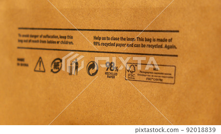 Recycling bag Closeup view of pap sign and other eco-label on Brown paper bag that is 100 recyclable and reusable spbd. Symbol indicates paper and cardboard. Concept Recycling bag Closeup view of pap sign and other eco-label on Brown paper bag that is 100 recyclable and reusable spbd. Symbol indicates paper and cardboard. Concept 92018839