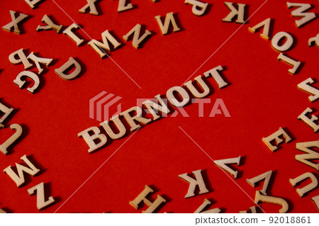 Word BURNOUT made out of wooden letters on bright red background. Motivational Words Quotes Concept. Word BURNOUT made out of wooden letters on bright red background. Motivational Words Quotes Concept. 92018861