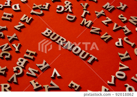 Word BURNOUT made out of wooden letters on bright red background. Motivational Words Quotes Concept. Word BURNOUT made out of wooden letters on bright red background. Motivational Words Quotes Concept. 92018862