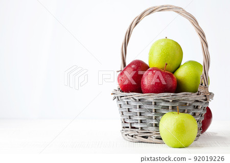 Colorful ripe apple fruits in basket 92019226
