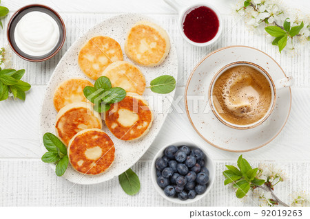 Cottage pancakes with jam, sour cream and berries 92019263