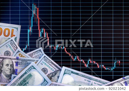 US dollar banknote stacks over digital screen with exchange chart, depreciation and volatility concept, directly above view US dollar banknote stacks over digital screen with exchange chart, depreciation and volatility concept, directly above view 92021042