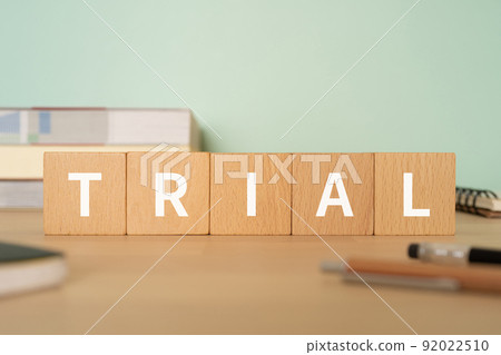 A desk with a block labeled "TRIAL" 92022510
