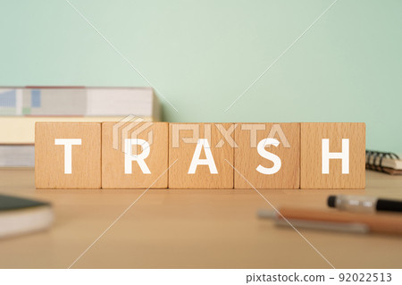 Image of garbage and waste | Desk with a block labeled "TRASH" 92022513