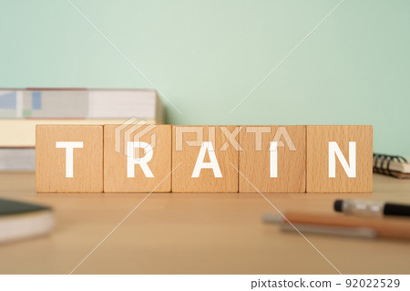 Image of train / training | Desk with a block labeled "TRAIN" 92022529