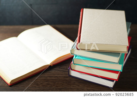 Books piled up on the table Books piled up on the table 92023685