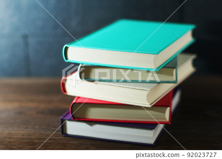 Books piled up on the table Books piled up on the table 92023727