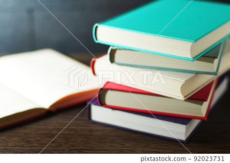 Books piled up on the table Books piled up on the table 92023731