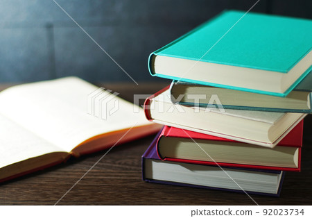Books piled up on the table Books piled up on the table 92023734