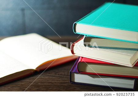 Books piled up on the table Books piled up on the table 92023735