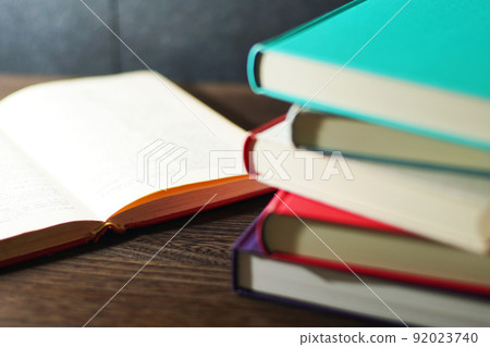 Books piled up on the table Books piled up on the table 92023740