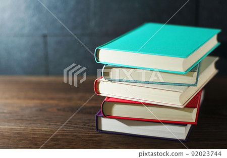 Books piled up on the table Books piled up on the table 92023744