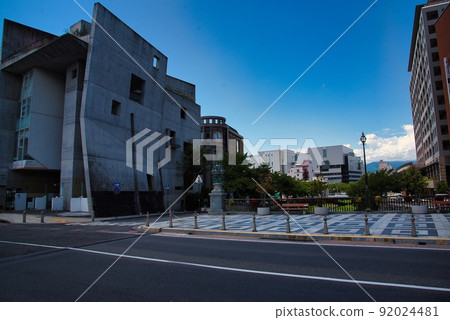 Matsumoto city (early summer, sunny weather, concrete building, sidewalk, blue sky, clouds) Matsumoto city (early summer, sunny weather, concrete building, sidewalk, blue sky, clouds) 92024481