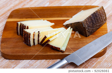 Slices of traditional Spanish aged sheep cheese 92026081