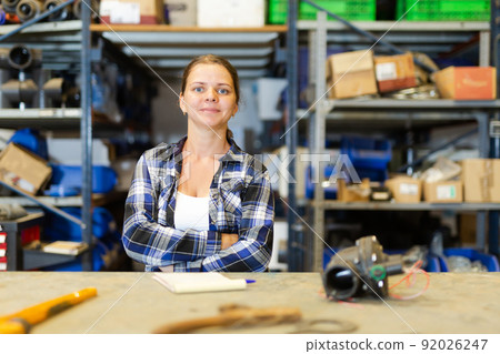 Portrait of positive woman warehouse worker 92026247