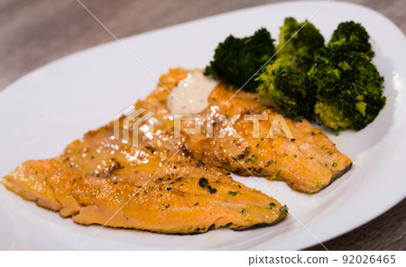 Fried trout fillets with broccoli Fried trout fillets with broccoli 92026465