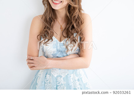 A woman in a light blue mini dress Short dress A woman in a light blue mini dress Short dress 92033261