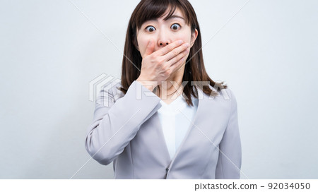 A business woman who is extremely surprised by unexpected events A business woman who is extremely surprised by unexpected events 92034050
