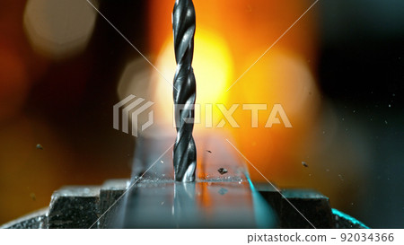 Drilling aluminium tube, close-up. Drilling aluminium tube, close-up. 92034366