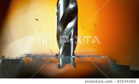 Drilling aluminium tube, close-up. Drilling aluminium tube, close-up. 92034368