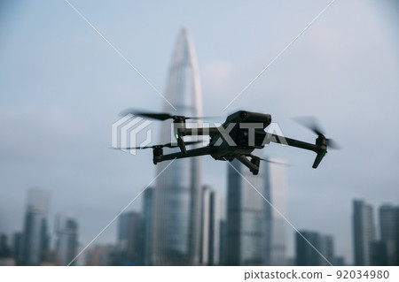 Flying drone in modern city 92034980