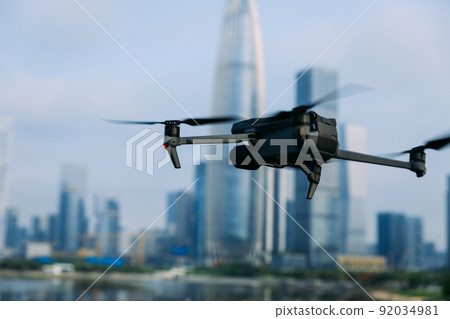 Flying drone in modern city 92034981