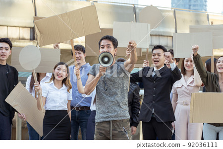 Leader of protestors shouting out for human rights 92036111