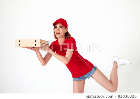 pizza delivery woman in uniform holding pizza boxes pizza delivery woman in uniform holding pizza boxes 92036326