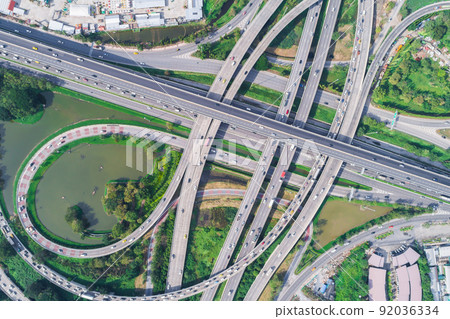 Traffic road junction view from above with green tree Traffic road junction view from above with green tree 92036334