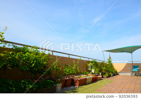 On a hot summer day, put your shade and camp chair on your balcony and feel like camping at home 92036393