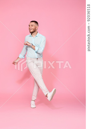 handsome smiling man in blue shirt dancing handsome smiling man in blue shirt dancing 92036518
