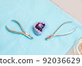 orthodontist doctor dentist correction of bite. children's plate on a cast of the jaw with tools on the doctor's table 92036629
